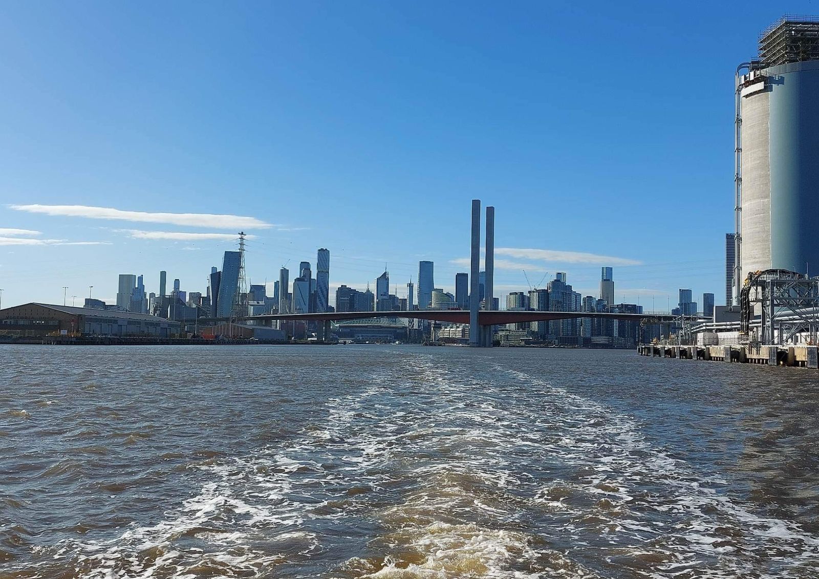 Looking back at the Bolte Bridge and city skyline from the ferry's wake