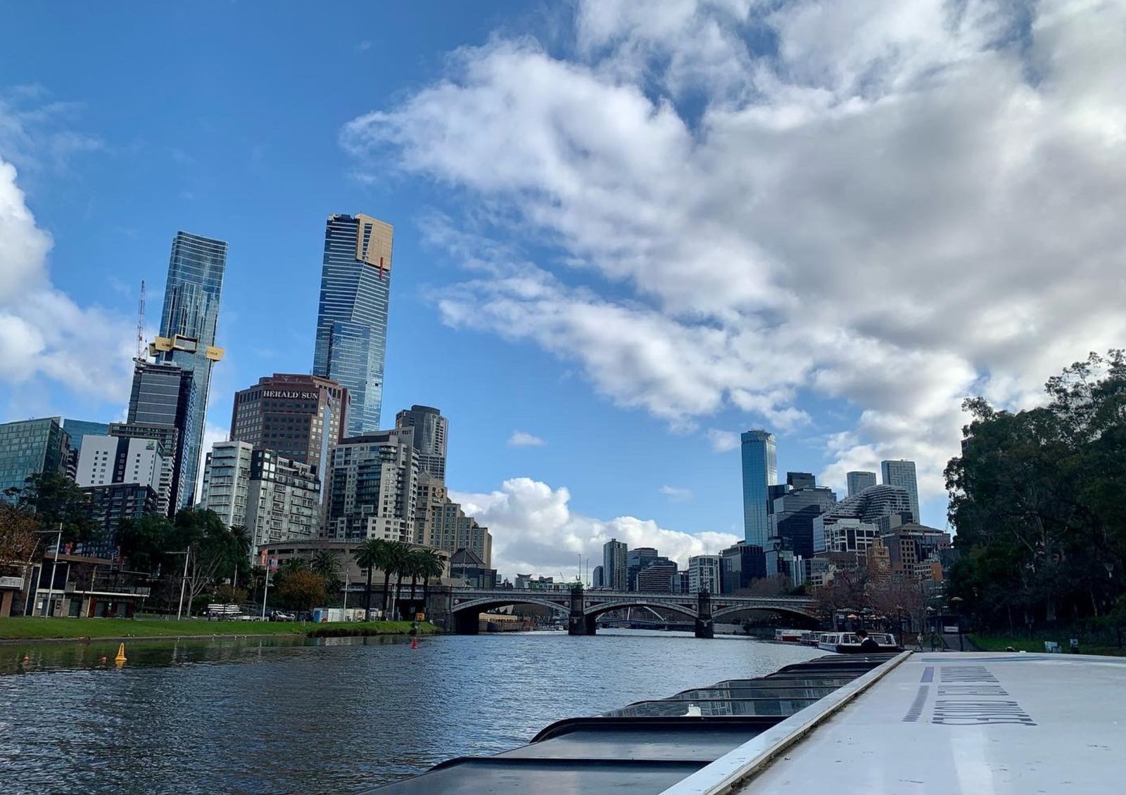 View from the ferry on the Yarra River at Southbank with Eureka Tower and Princes Bridge ahead